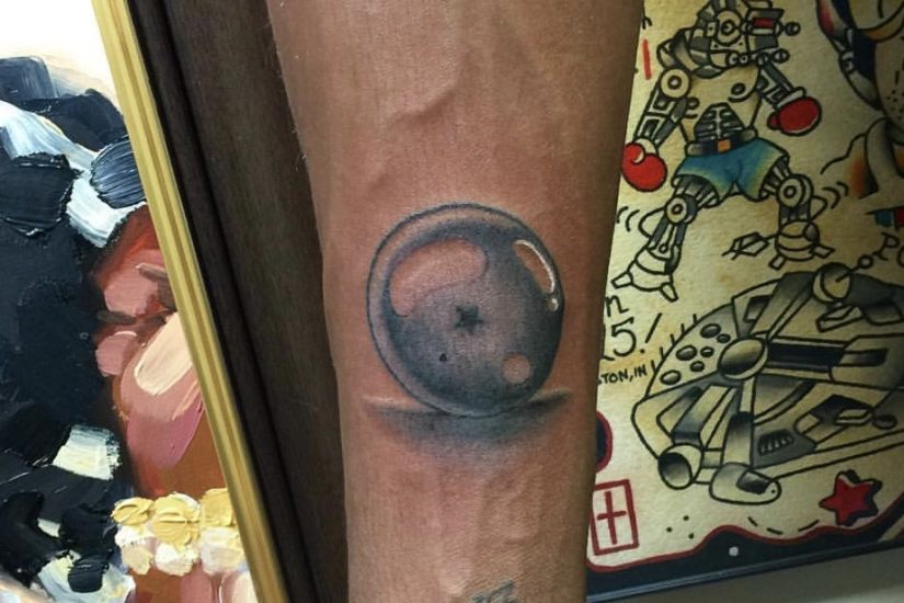 Black and grey tattoo of a Dragon Ball