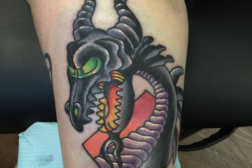 Tattoo of a Dragon on a girl's inner arm