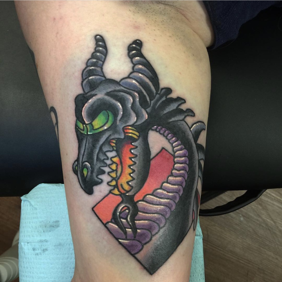 Tattoo of a Dragon on a girl's inner arm